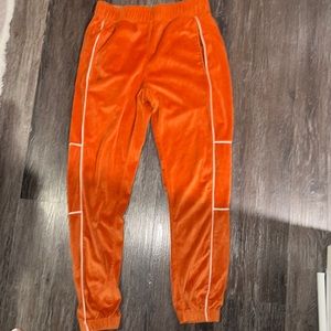 Orange suede track pants